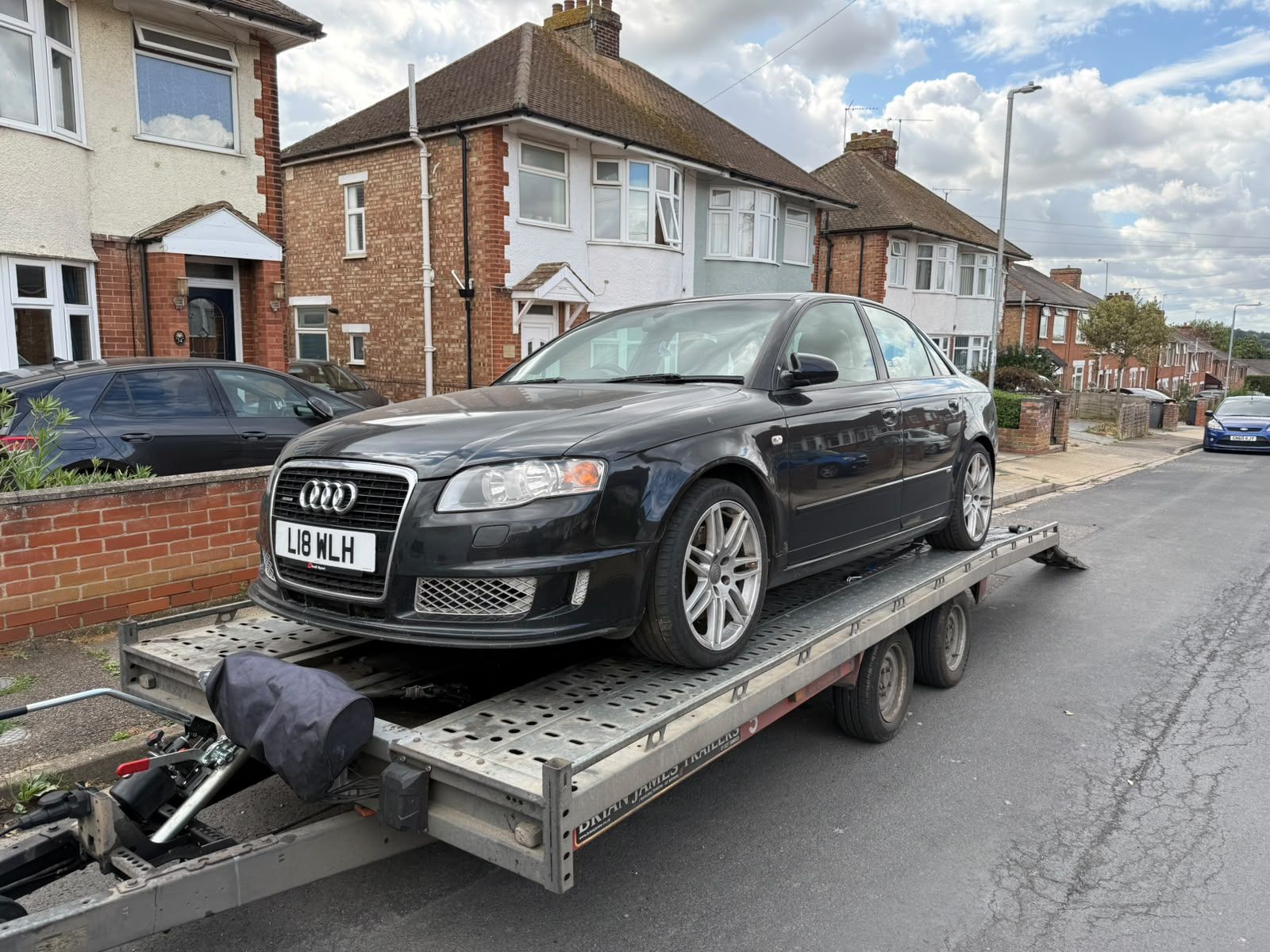 Black Audi A4 on the SV Transport trailer, ready to be moved